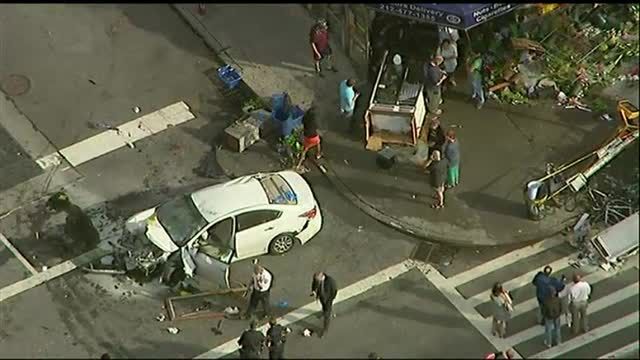 News video: Raw: Car Jumps Curb in NYC, Injures 8